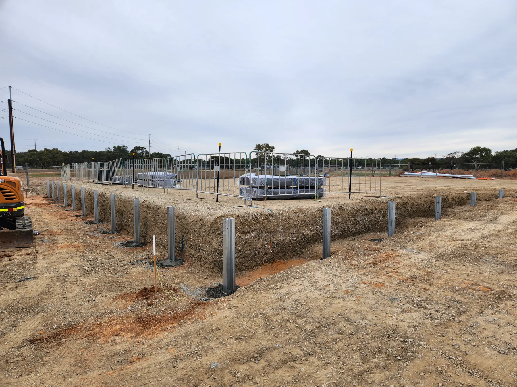 Sleeper retaining wall mid-build on a difficult Adelaide block