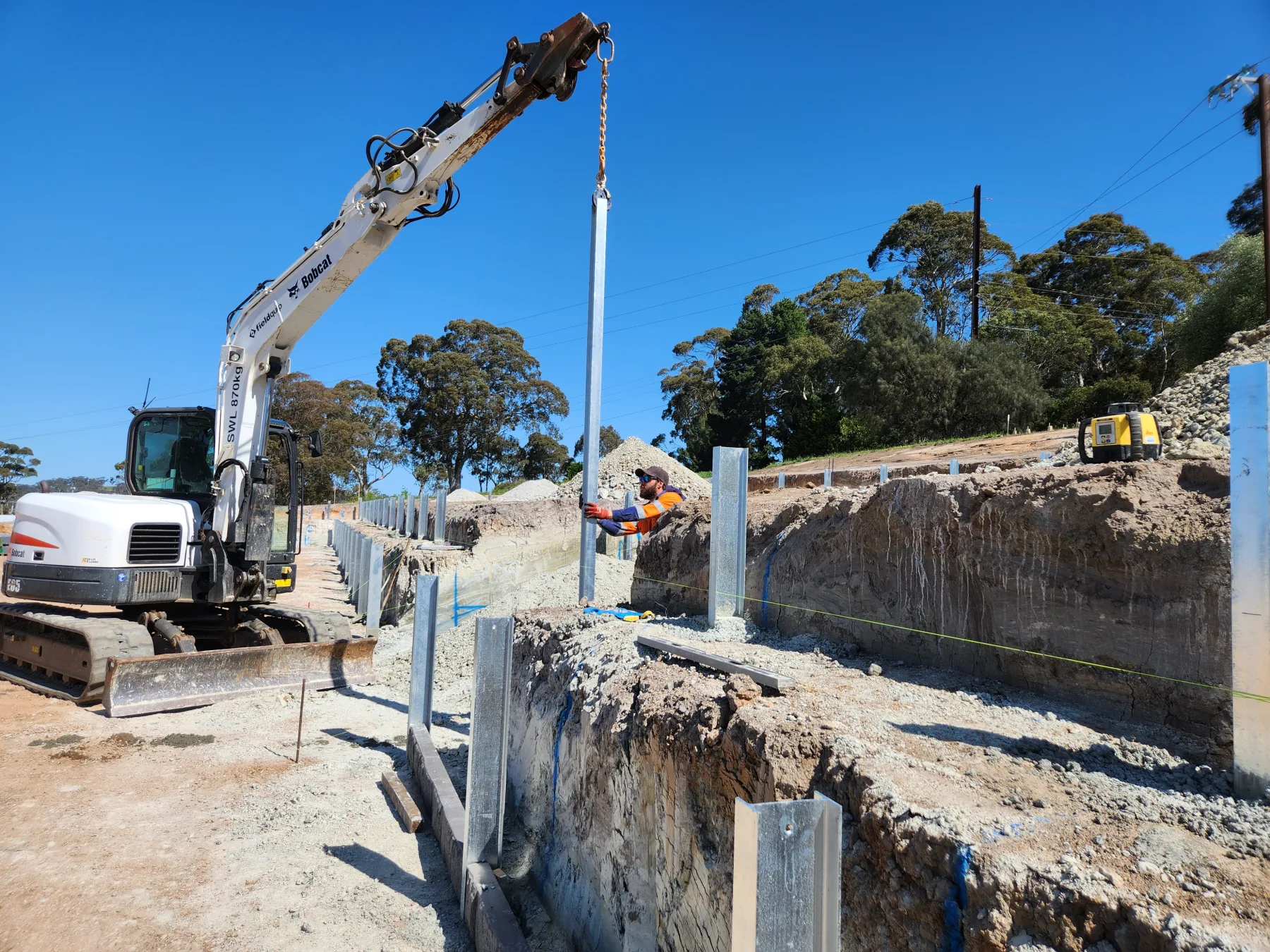 Completed engineered wall along a steep boundary