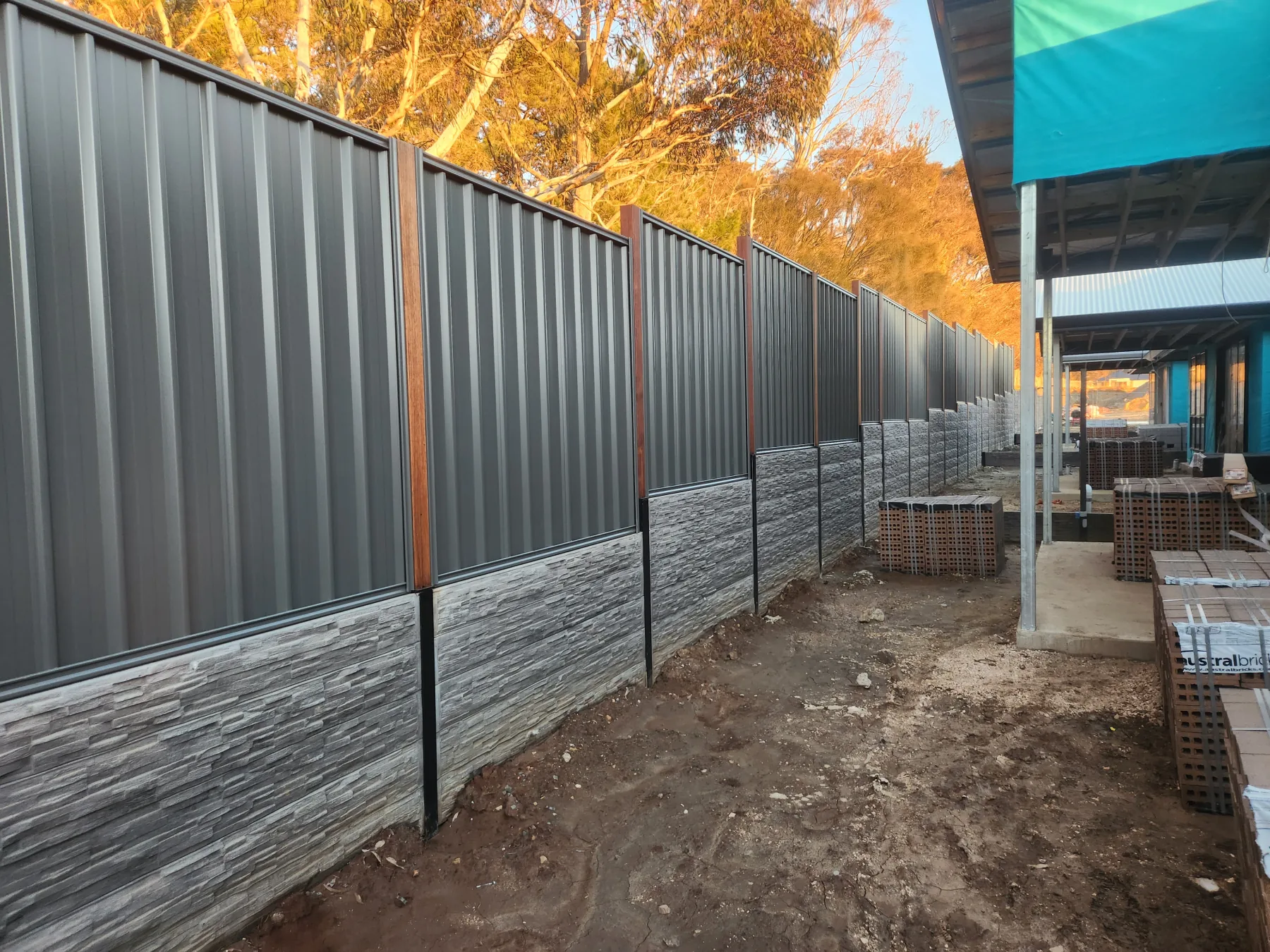 Curved engineered retaining wall on a sloped residential property
