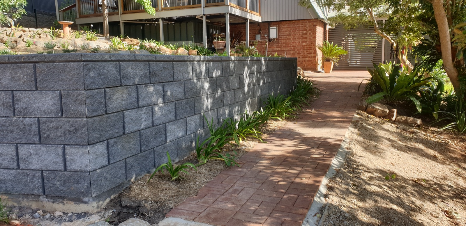 Finished residential retaining wall with landscaped path, Adelaide